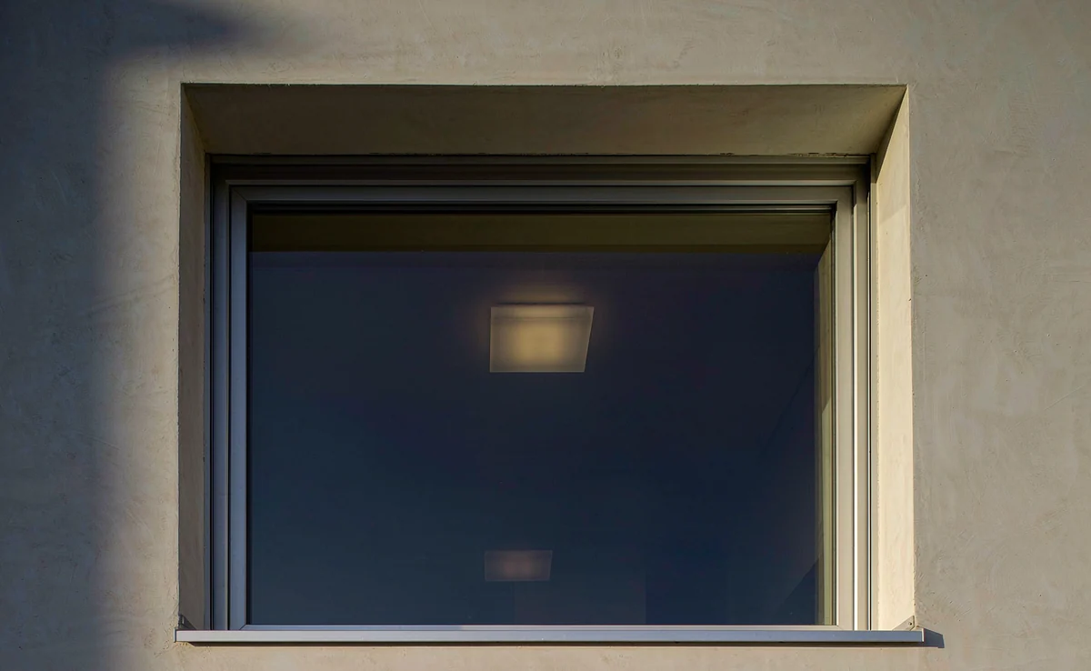 Large window at dusk showing the low-e coating and the glass unit edge