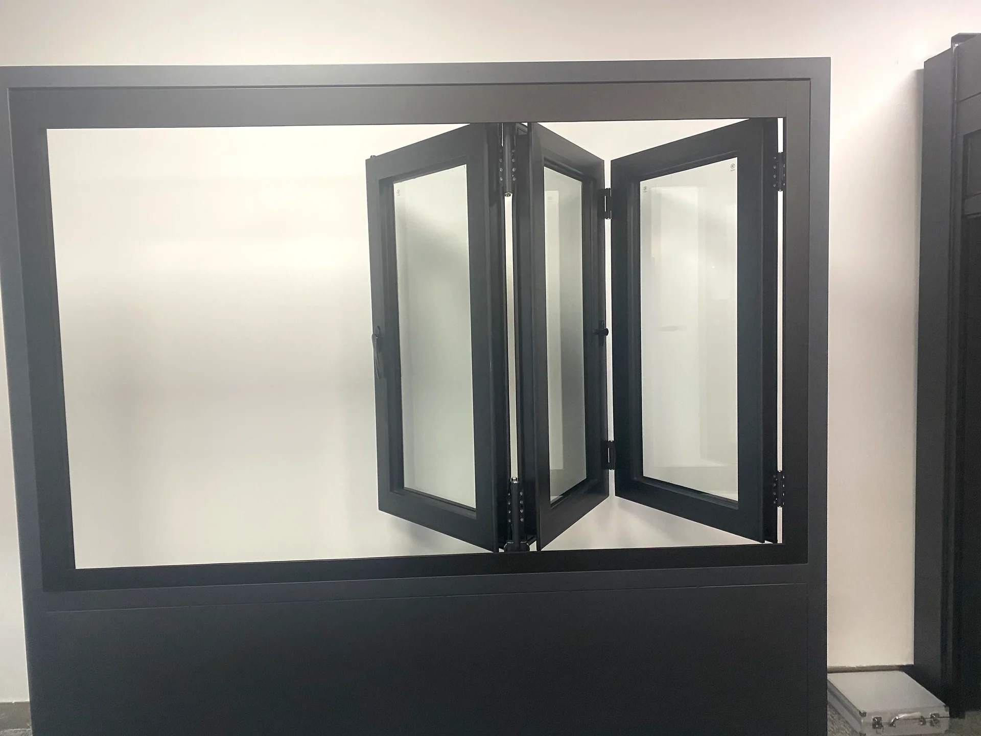 Folding glazed sample shown in an open showroom configuration