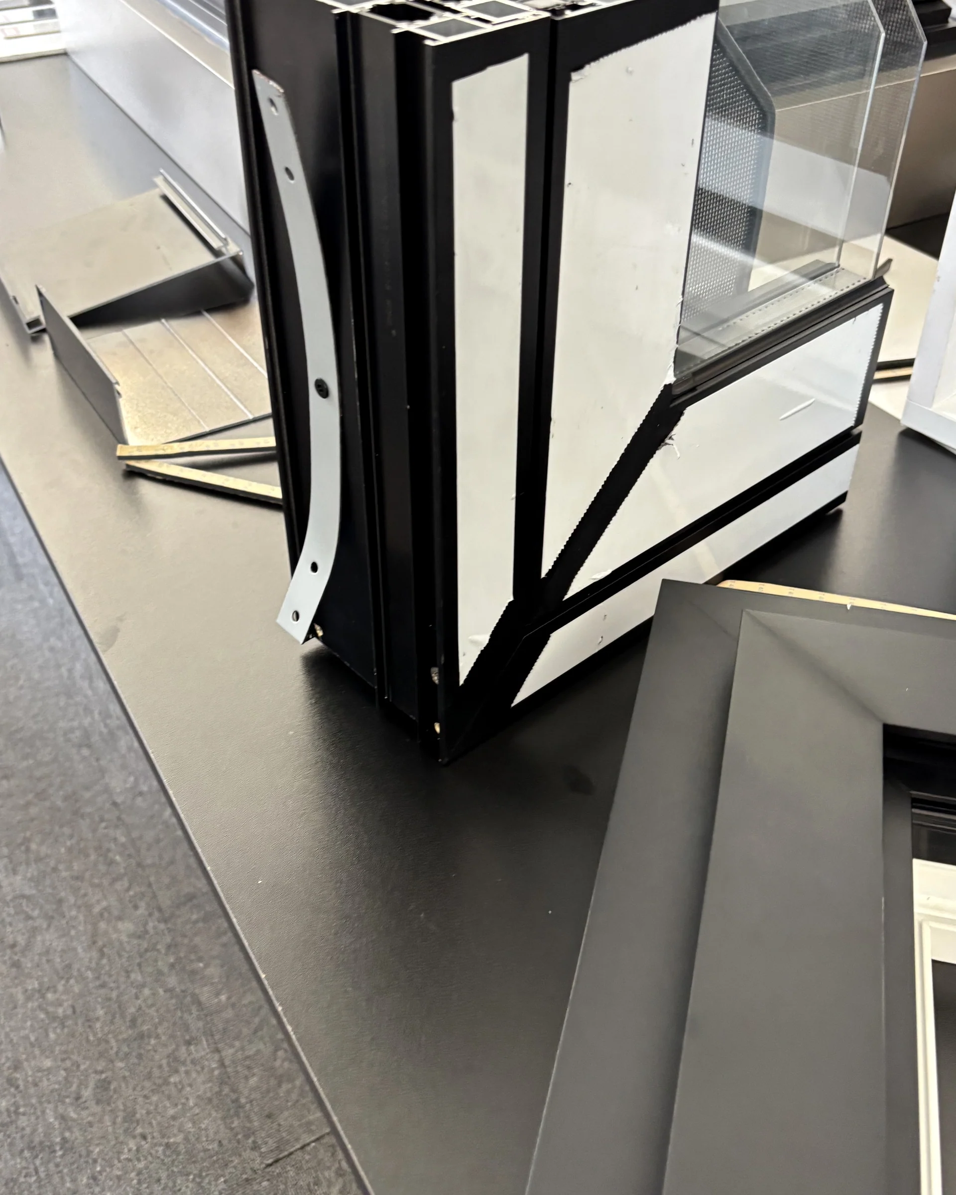 Folded aluminium-framed door sample; no Australian project attribution.