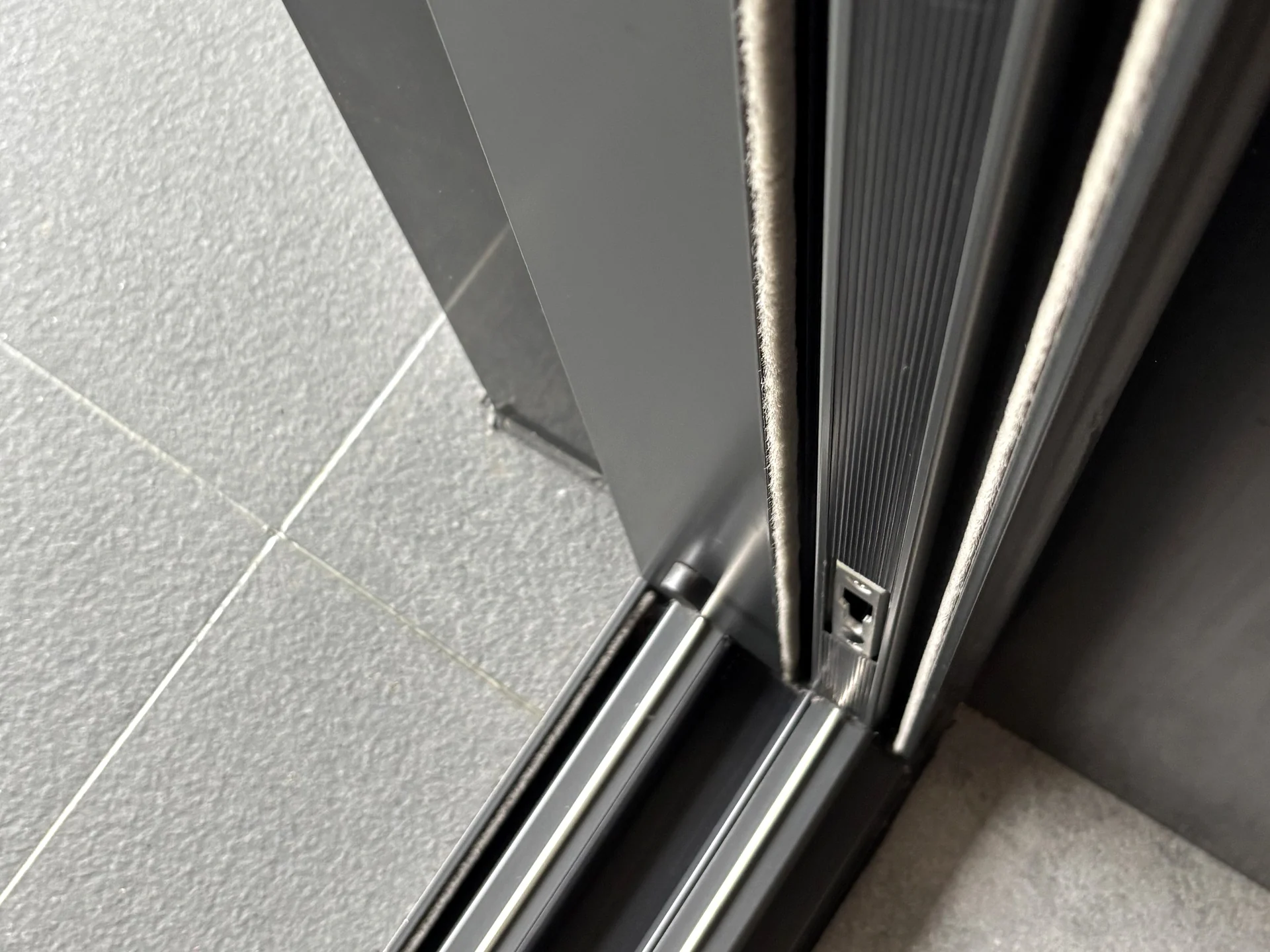 Photographed aluminium door frame and threshold corner