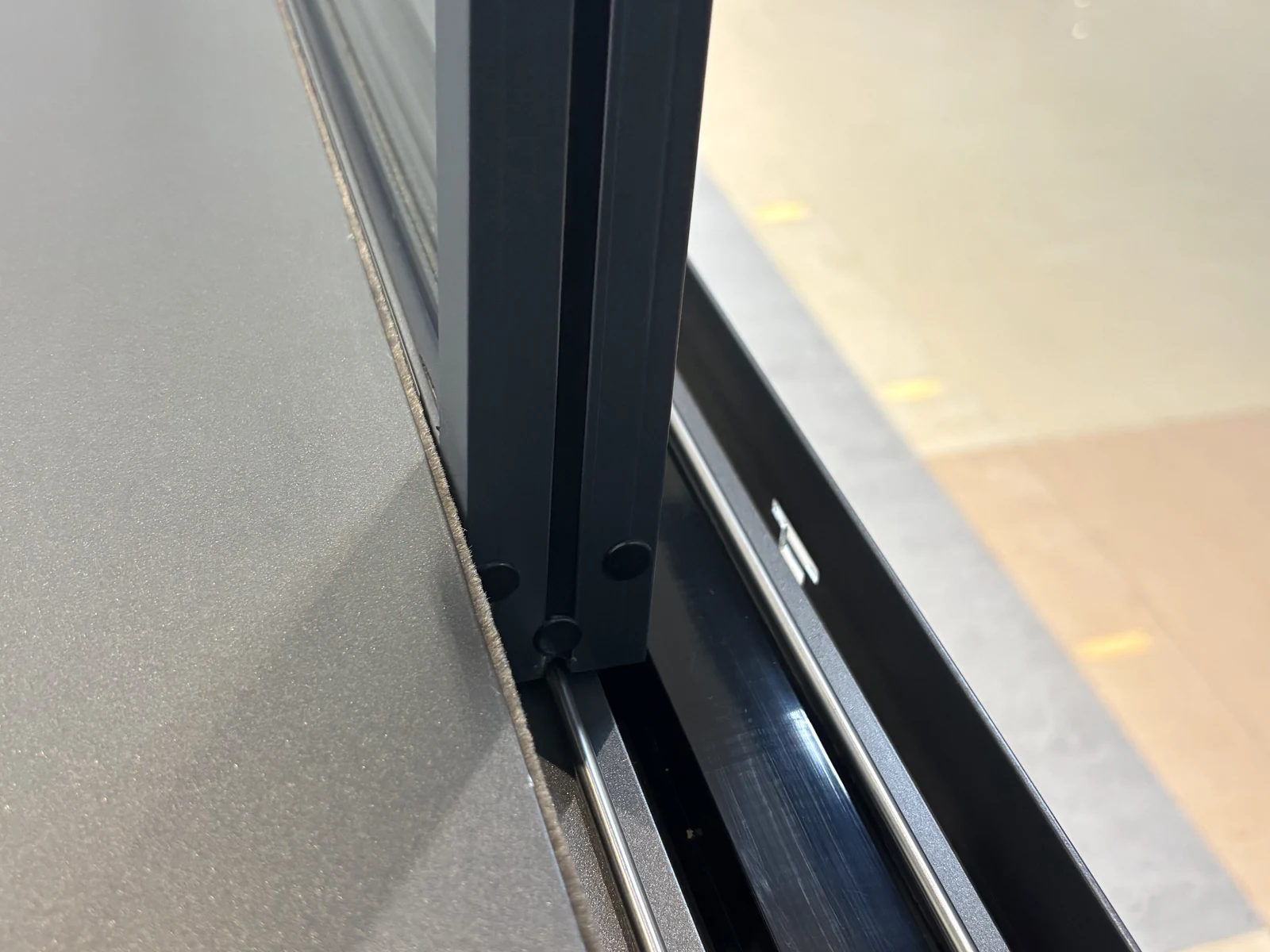 Close view of the sliding-window frame and sash edge